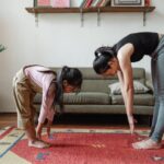 photo of woman and girl stretching their body · fr